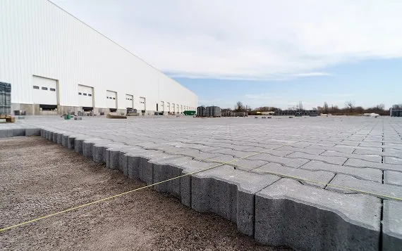 Paved industrial yard with concrete blocks for durable surface at G&G Concrete Inc.